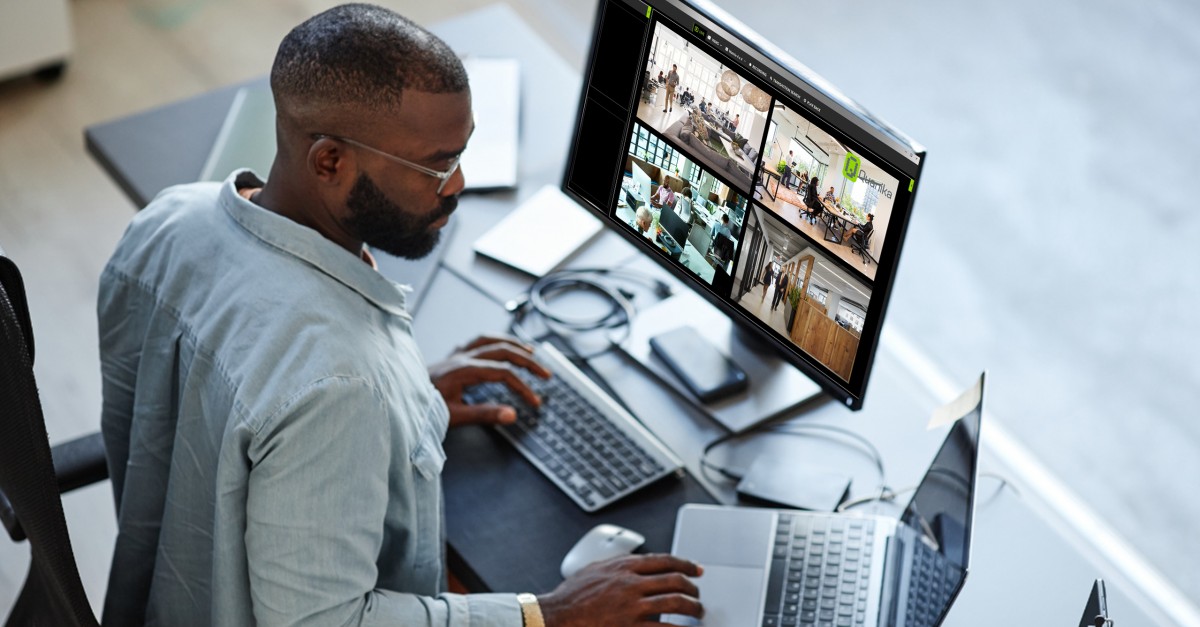 person on a computer with cctv on
