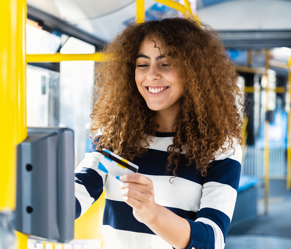 women using MIFARE DESFire cards in a transport setting