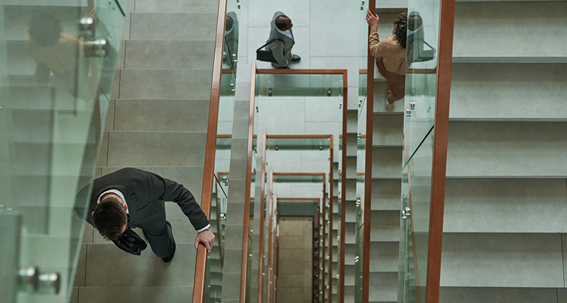 image-of-man-going-downstairs-in- business-setting