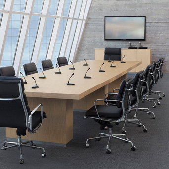 Conference room with boundary microphones on the desk