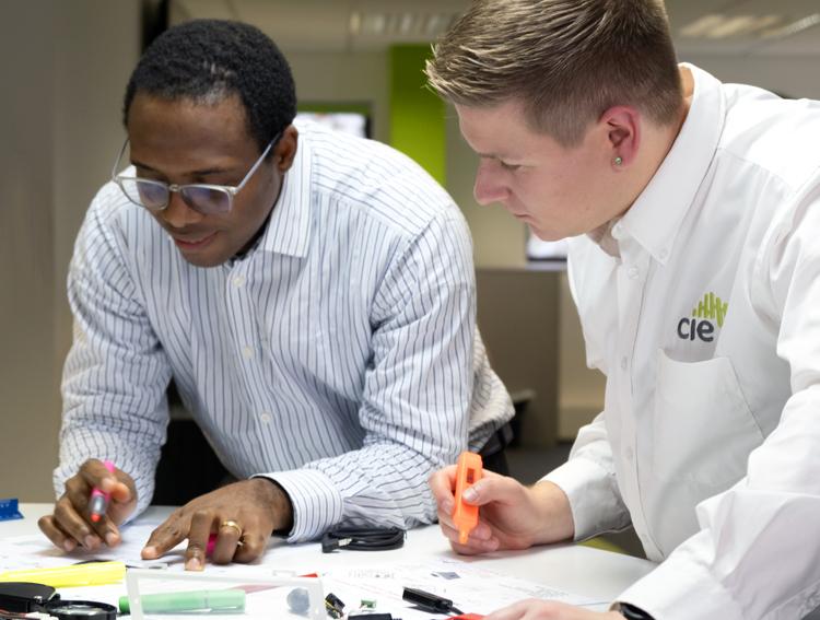 CIE lockdown system designers reviewing project plans