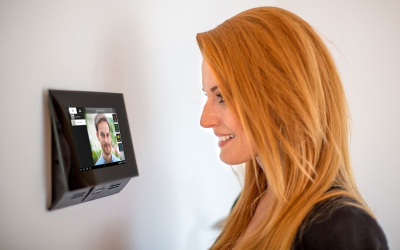 Resident using a smart home door entry panel