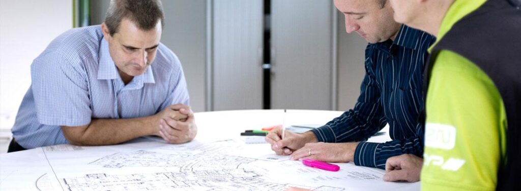 CIE system designers reviewing project plans