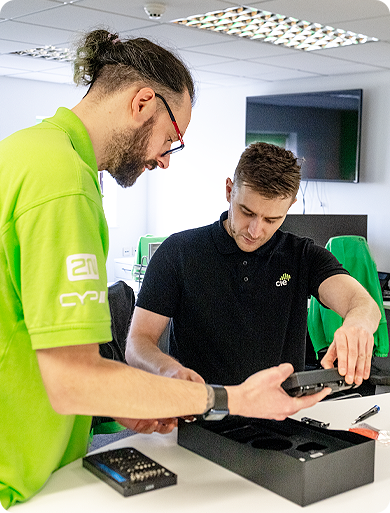 CIE Group team members demonstrating and configuring access control equipment in a technical workspace